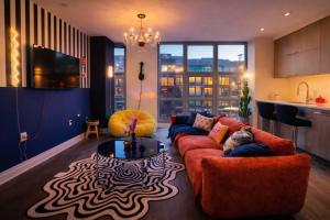 a living room with a couch and a table at The Casa - U Street in Washington, D.C.