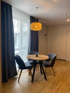 a dining room with a table and chairs at Готель Поляницький in Bukovel