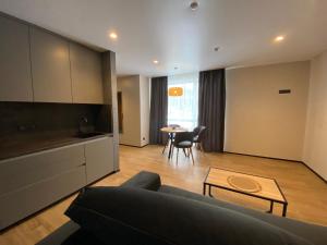 a living room with a couch and a table at Готель Поляницький in Bukovel