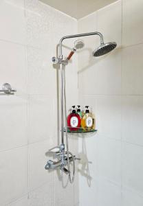 a shower with a shelf in a bathroom at MIIN Stay02 in Seoul