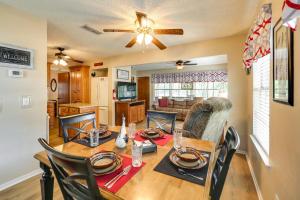 a dining room and living room with a table and chairs at Papas Lakefront Hideaway in Chico +20 photos