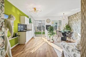 a living room with a couch and a table at Luxury Long-Term Apartment with Terrace in Vienna
