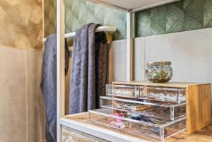 a dresser in a bathroom with a mirror at Luxury Long-Term Apartment with Terrace in Vienna +182 photos