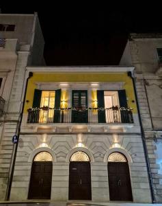 a building with a balcony on top of it at Casa Tanina in Bitonto