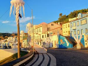 a view of a street with houses and a boat at SEASTAR nº38 in Horta