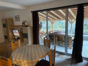 a kitchen and dining room with a table and a window at Vila Panic in Pirot +11 photos