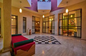 an empty lobby with a checkered floor at Zen Zone Boutique Riad & Spa in Marrakesh +108 photos