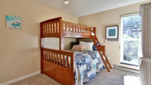 a bedroom with a bunk bed in a room at Beachfront Condo - Mutiny Bay by AvantStay Views in Freeland +30 photos