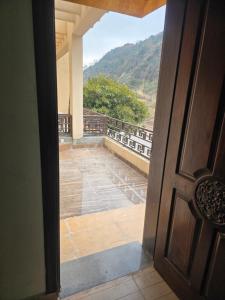 an open door with a view of a balcony at Bahria enclave sect N in Islamabad