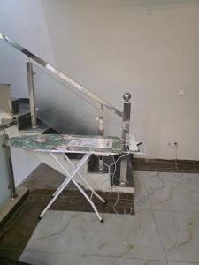 a desk in a room with a table at Bahria enclave sect N in Islamabad