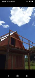 a house with a roof on top of it at Casita Walden in Cosquín