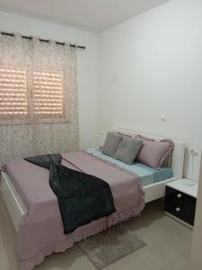 En eller flere senge i et værelse på Casa Melissa