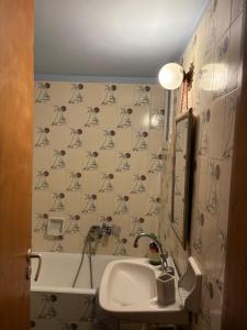 a bathroom with a sink and a mirror at Villa Arginonta in Kalymnos +36 photos