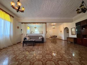 a living room with a couch and a table at Villa Arginonta in Kalymnos