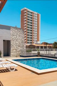 a swimming pool on the roof of a building at Hotel Pousada do Farol in Aracaju