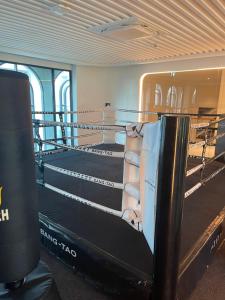 a room with a boxing ring in a building at Andaman 3 in Ban Thalat Choeng Thale