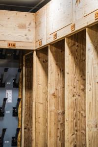 a wall of wood panels in a room at Hotel Emeraude in Peisey-Nancroix +117 photos
