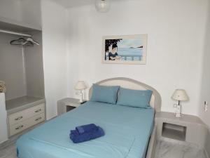 En eller flere senge i et værelse på Υδρία-Κατοικίες Hydria-Houses