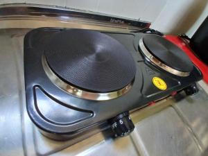 a black speaker sitting on top of a stove at Camburi Chalet - por do sol in São Sebastião +21 photos