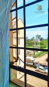 a view through a window of a building at Makasembo breeze homes in Kisumu