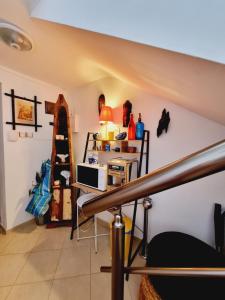 a room with a staircase and a room with a shelf at Casa DELL'ARTE in Ahtopol