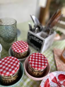 three bowls of food sitting on a table at Ferienzimmer Teiselsmühle Gehren Heideblick in Heideblick