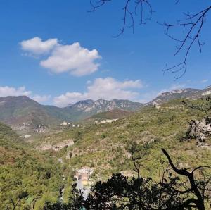 a view of a valley with mountains in the background at La Ginestra in Bastia