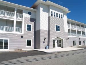 a large white building with aventh floor at Seaside Haven in Seabrook