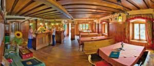 a train car with tables and a bar in it at Gästezimmer Buchegger in Krumbach Markt