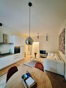 a living room with a white couch and a table at Monti26 in Milan