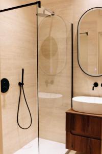 a bathroom with a sink and a shower at Monti26 in Milan