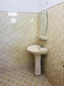 a bathroom with a sink and a mirror at Sun Shine House in Matara +44 photos