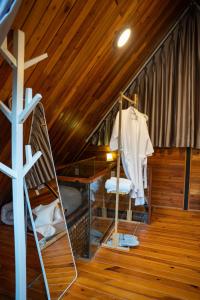 a room with a attic with a ladder and a cross at tinys house in Lạc Dương +162 photos