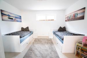 En eller flere senge i et værelse på Ferienhaus nah der Ostsee, 110qm mit eigenem Garten