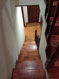 a stairway with wooden stairs and a wooden floor at Hotel Paulista in Porto +129 photos