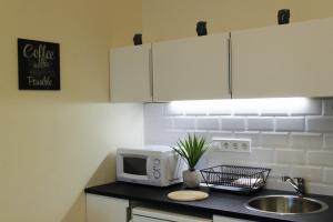 Kuchyňa alebo kuchynka v ubytovaní Concept Apartments