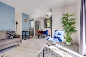 a living room with a couch and chairs and a table at 6 - Persoons Forest 67 Bungalow in Ewijk