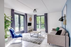 a living room with a couch and a table at 6 - Persoons Forest 67 Bungalow in Ewijk