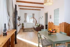 a living room with a table with a bowl of fruit on it at Agata's House in Viagrande