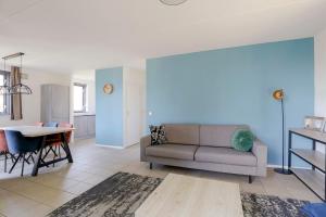 a living room with a couch and a table at 6 - Persoons Forest 185 Bungalow in Ewijk