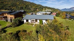 an aerial view of a house on a hill at Mazot Ferienhaus Kleinwalsertal in Riezlern
