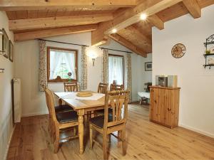a dining room with a wooden table and chairs at Landhaus Eschenbach in Schönau am Königssee