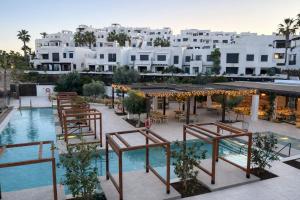 a view of a hotel with a pool and buildings at Apartamento Califato 5 in Mojácar