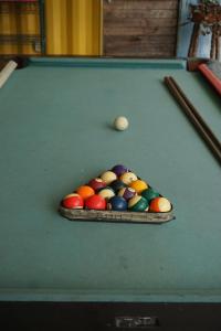 a pool table with a bunch of balls on it at EL TUMBO in El Gigante