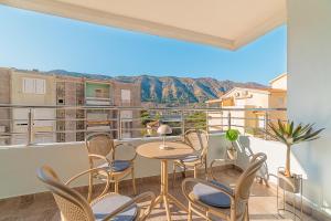 a balcony with chairs and a table with a view at Apartments TIME in Kotor