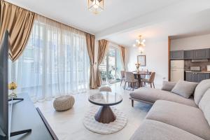 a living room with a couch and a table at Apartments TIME in Kotor
