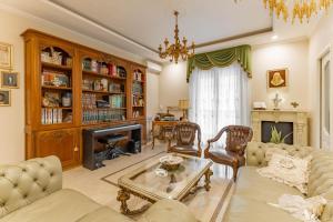 a living room with a couch and a fireplace at Armea Suite Apartment in Trani