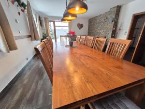 a dining room with a wooden table and chairs at Chata Marta in Boží Dar