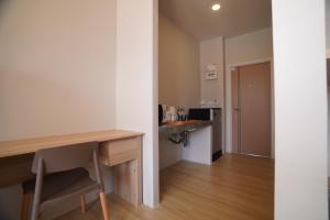 Una cocina o kitchenette en Sinapa Suites