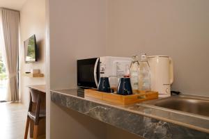 Una cocina o kitchenette en Sinapa Suites